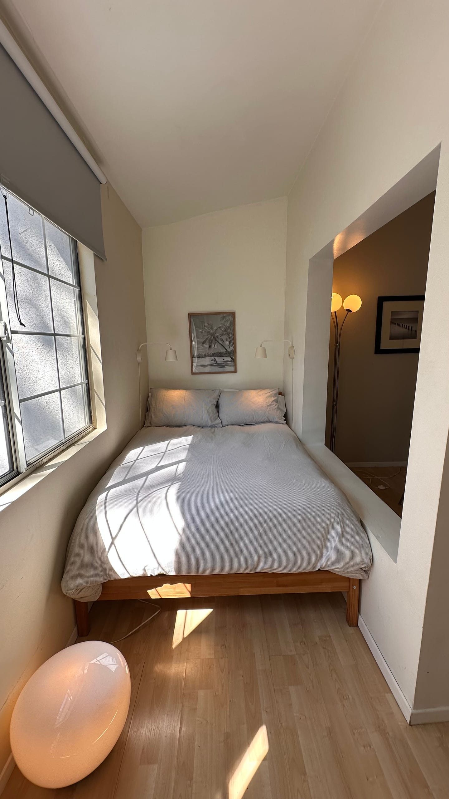 The den at the back of the studio, full bed under a casement window
